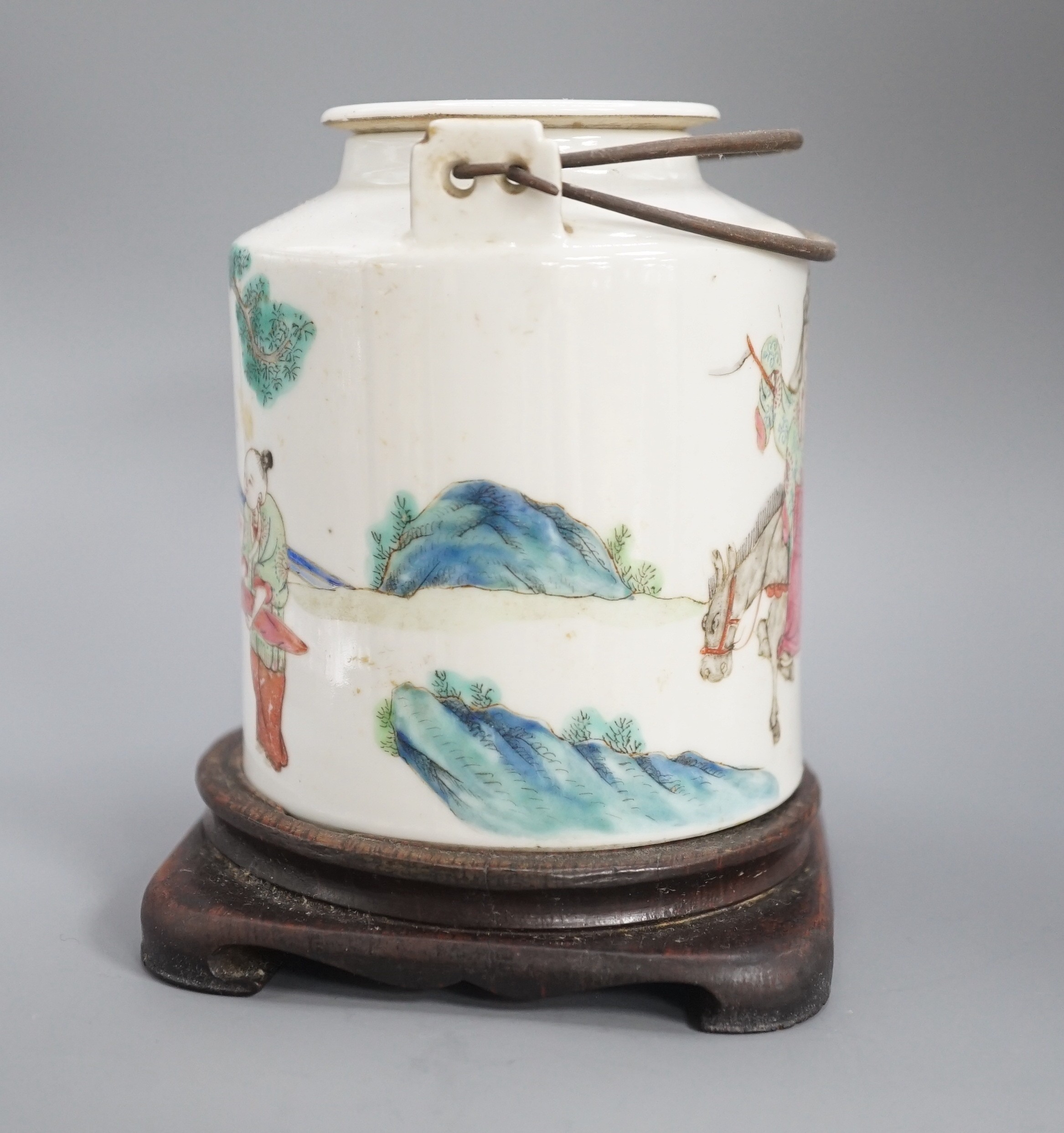 A Chinese famille rose cylindrical teapot and cover, 19th century 11cm, wood stand